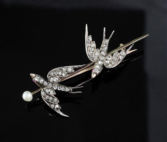A Victorian gold, pearl and rose cut diamond set twin swallow bar brooch, 57mm.